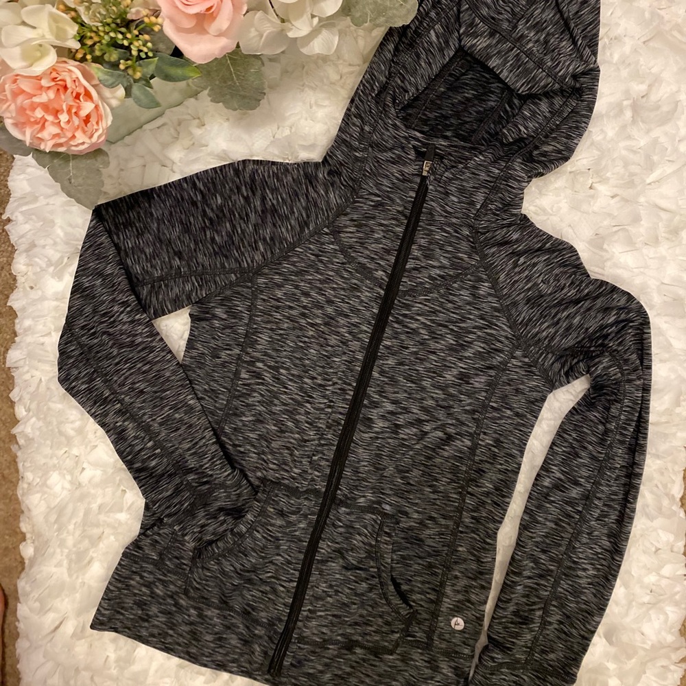 Very warm hooded zip up sweater. With side pockets